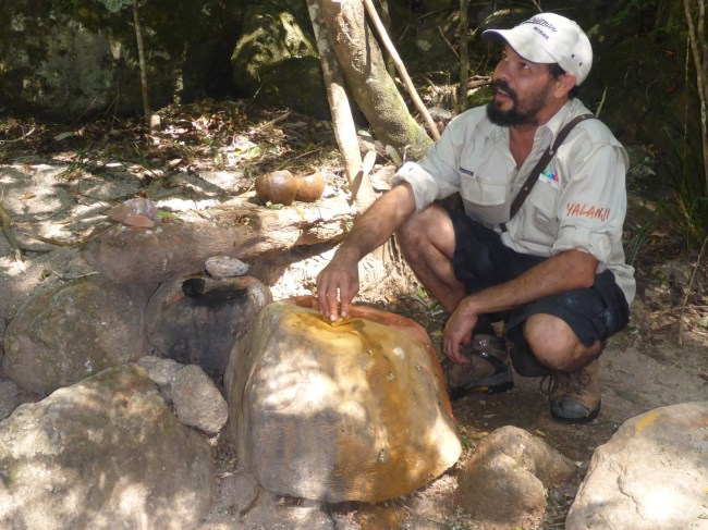 Mixing up the paint for body decoration.