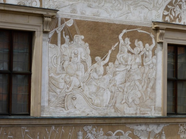 A base layer of plaster then a second one that's carved in bas relief. Nice.
