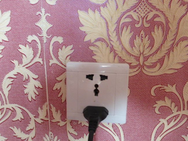 This socket could take at least three types of plug, including a British 13 amp.