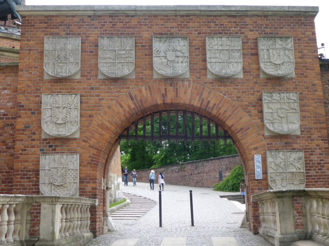 The original entrance arch with coats of arms.