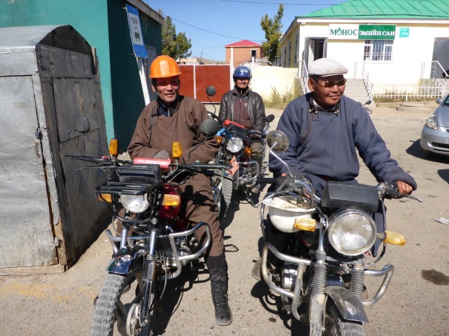 Taxi motorcycles. I love the crash helmets!