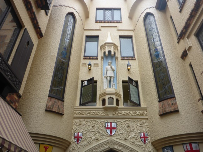 Dick Whittington and his cat look down on the shoppers.