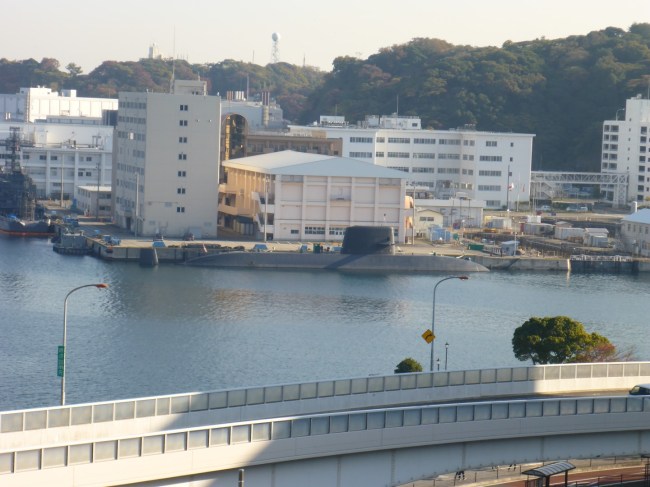 Japanese sub moored opposite the US ship. Just as well they're friends these days!