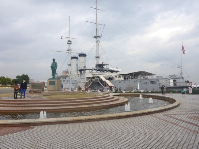 Togo memorial with the Mikasa behind.