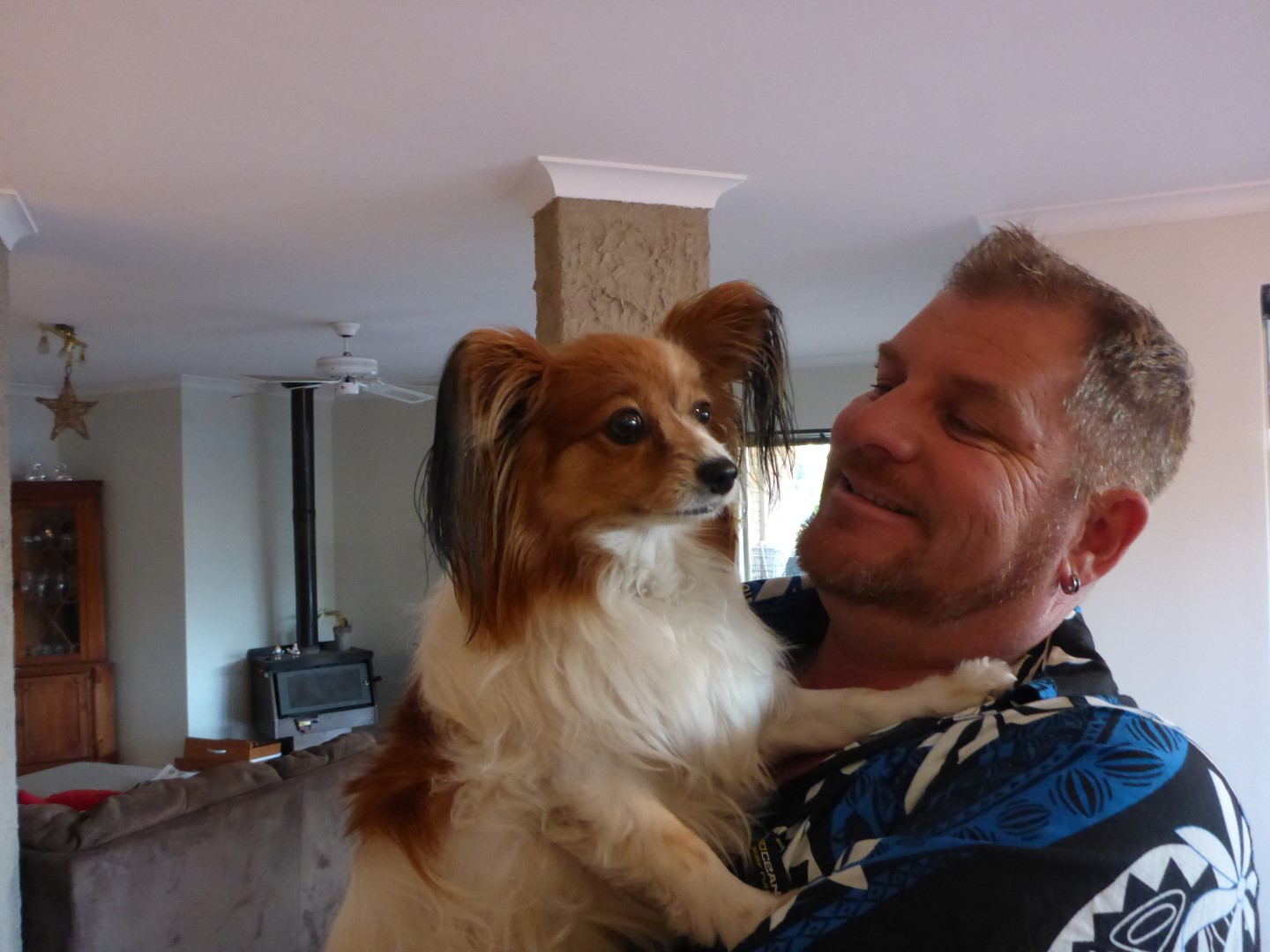 Paul and one of the family pets, a Papillion dog.