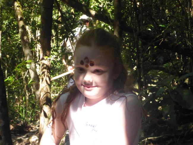 The youngest member of the group gets persuaded to be decorated.